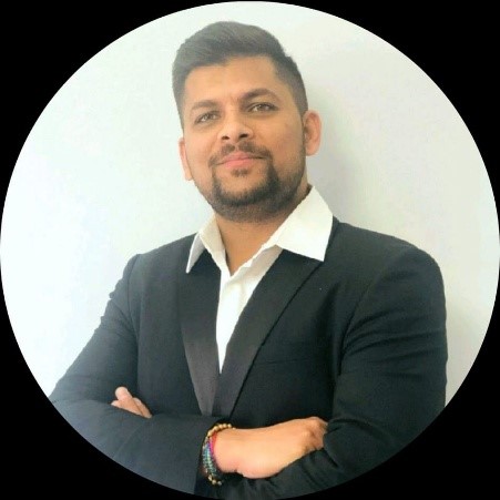 Lav Soni, Board Director at Alberta Independent Pharmacy Association, in formal attire against a light background.