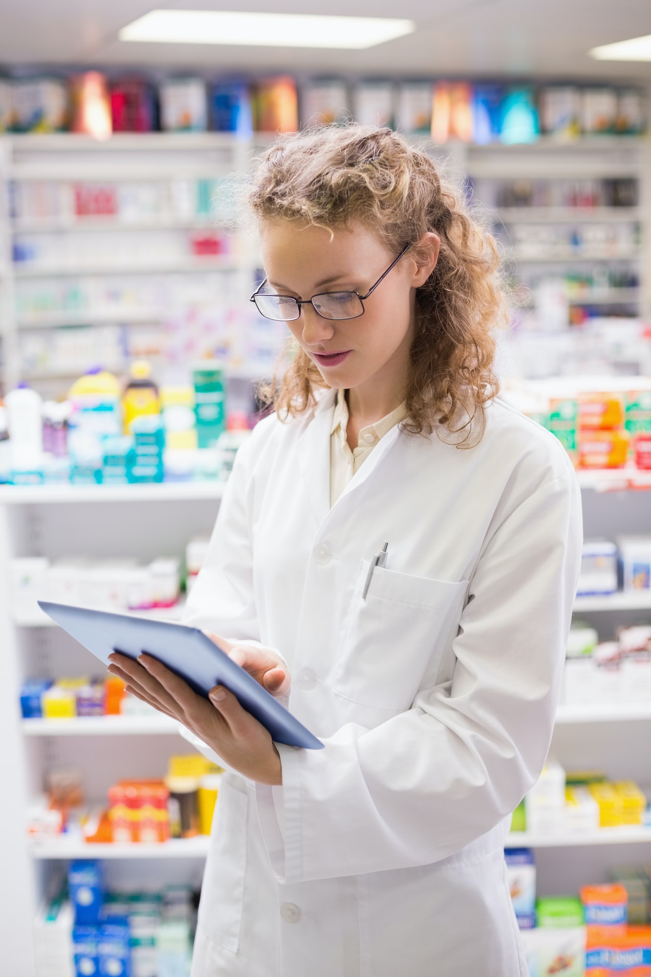 Pharmacists assisting customers in a pharmacy, reflecting Alberta Independent Pharmacy Association’s mission and core values.